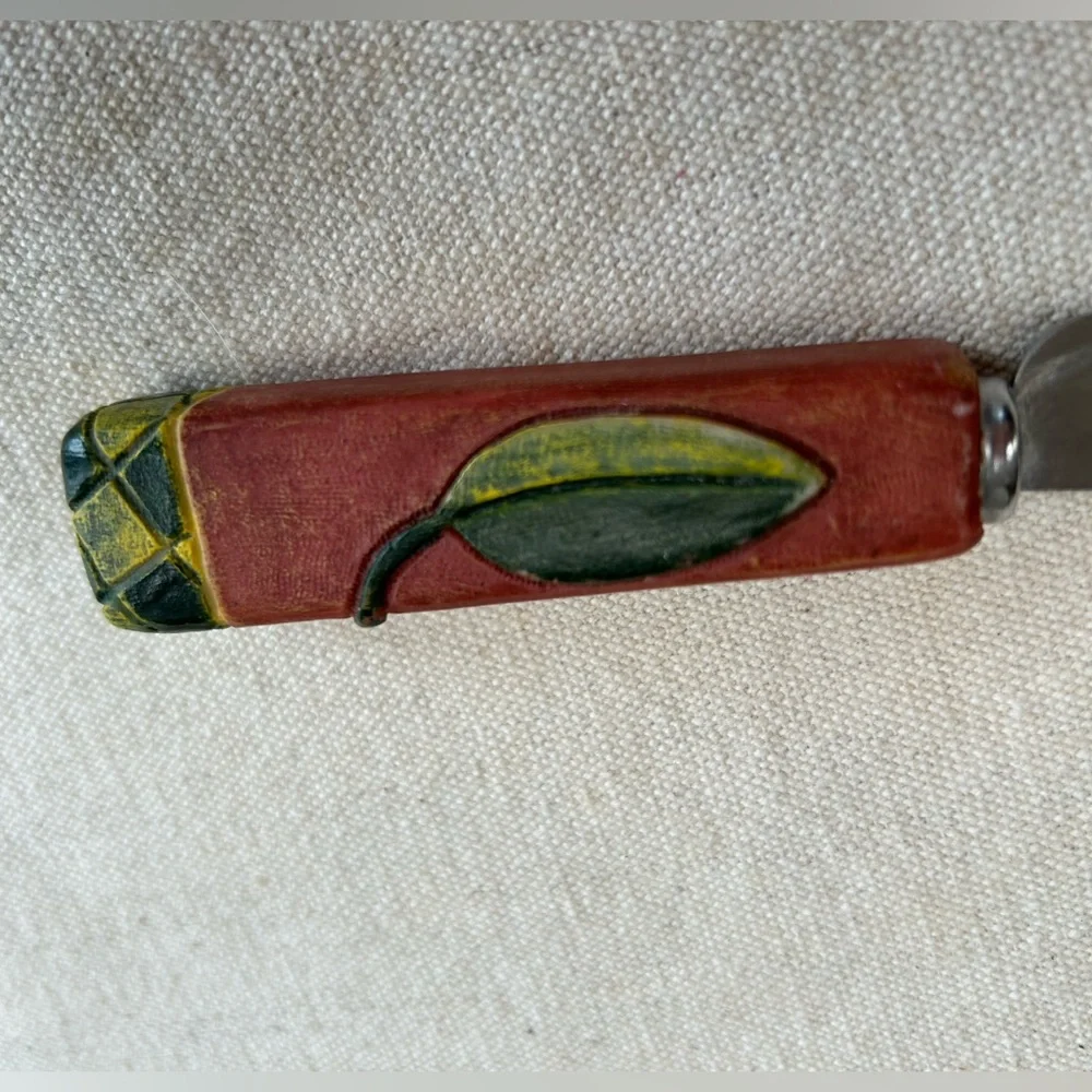 Joie de Vivre hooked blade cheese knife w carved leaf handle. Perfect addition !